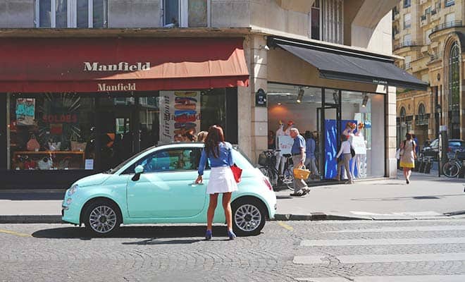 woman getting into car