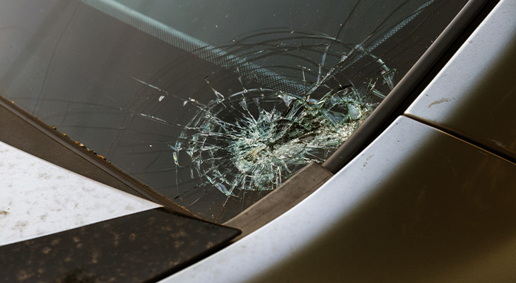 Closeup of a section of a damaged windshield