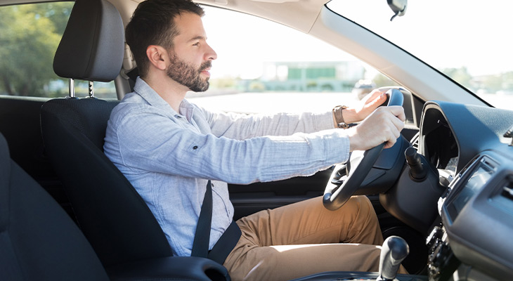 Young man driving car