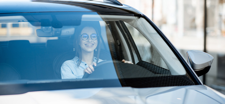 Woman with glasses driving