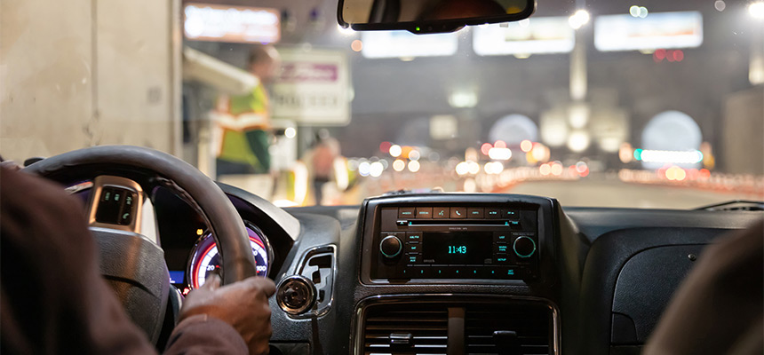 Backside view of driver and car dashboard