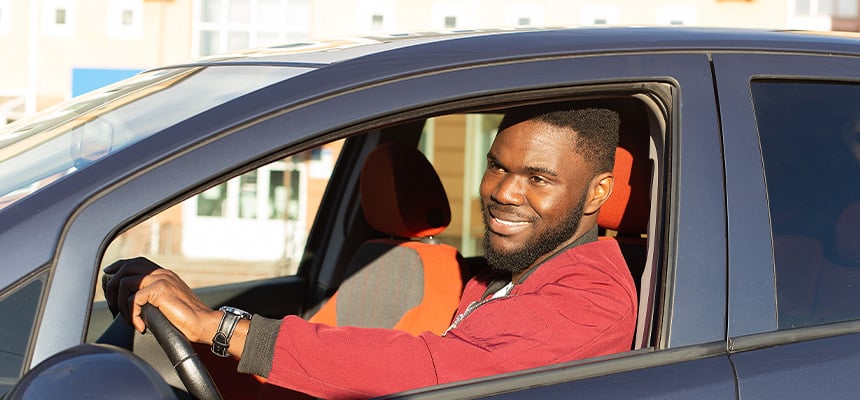 man driving a car