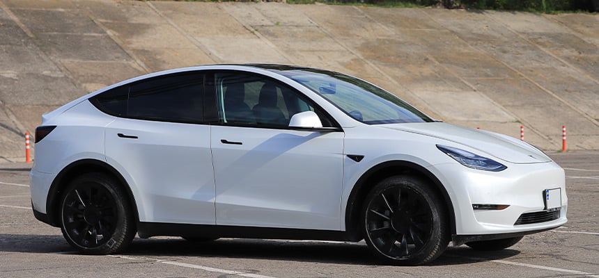 A parked white Tesla Model Y