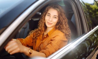 Woman behind the wheel of a car