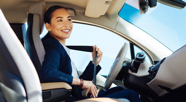 Woman buckling her seat belt