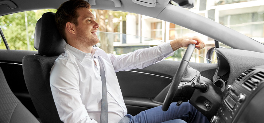 Uber driver smiling while driving